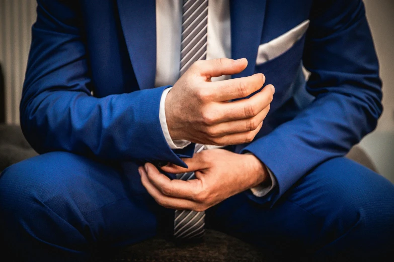 this is a man's hands on his lapel