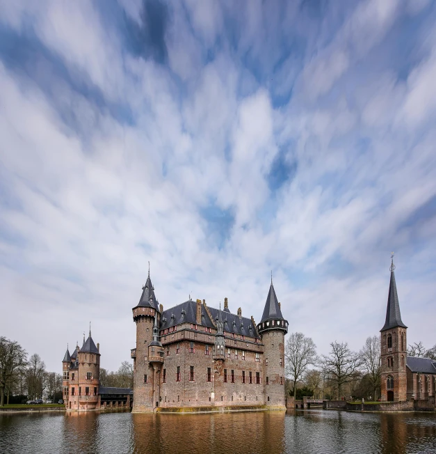 a castle sits in a large body of water