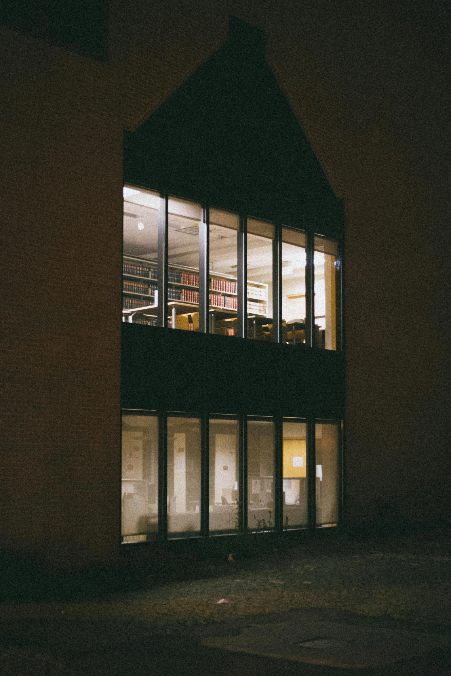 the night view of a large building at a corner