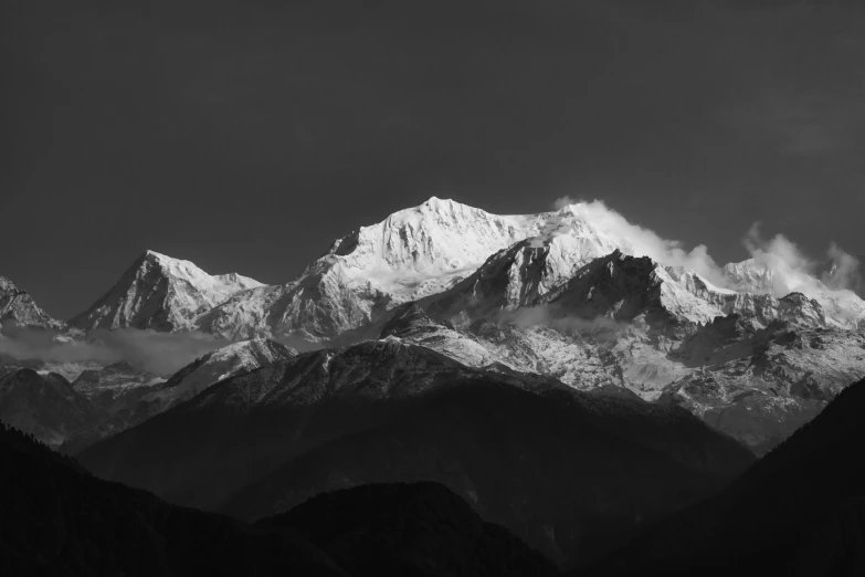 a mountain top with snow on the mountains