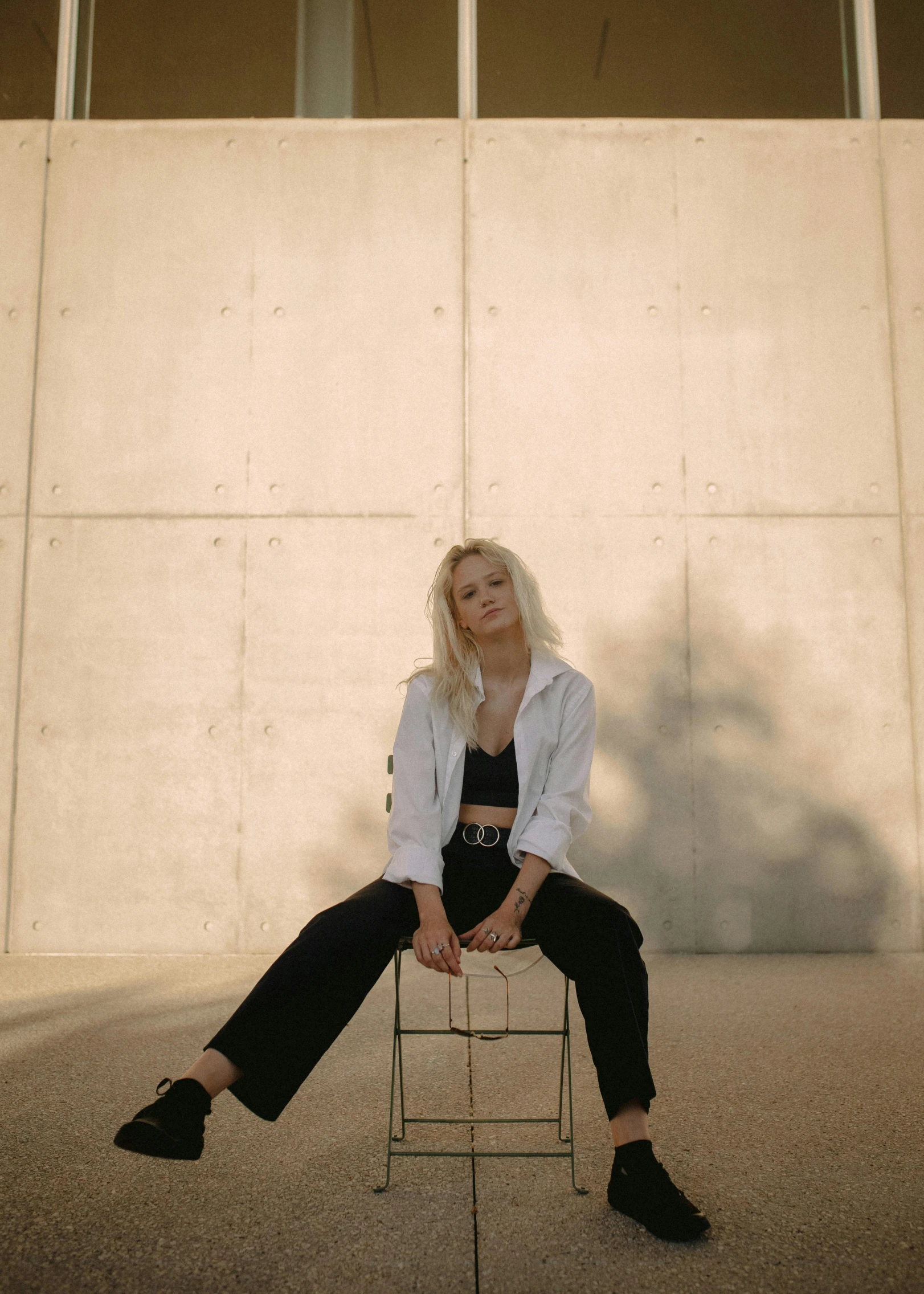 a woman sitting down on top of a chair