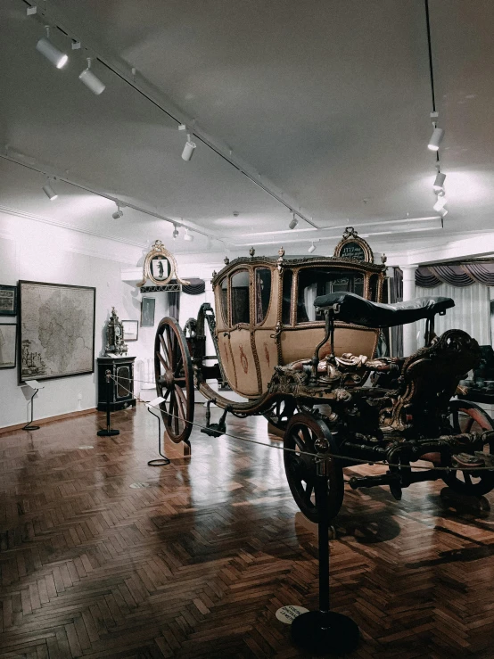 there is an antique car on display in the room