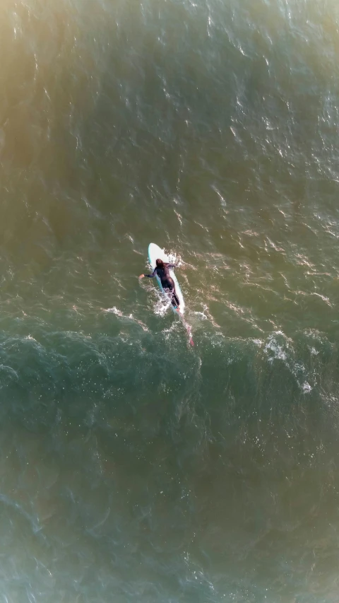 a man is surfing on top of a wave