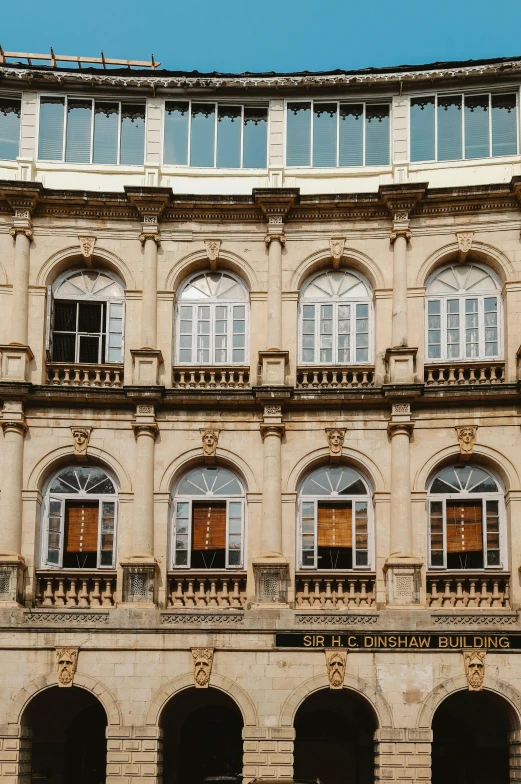 a very tall and old style building with many windows