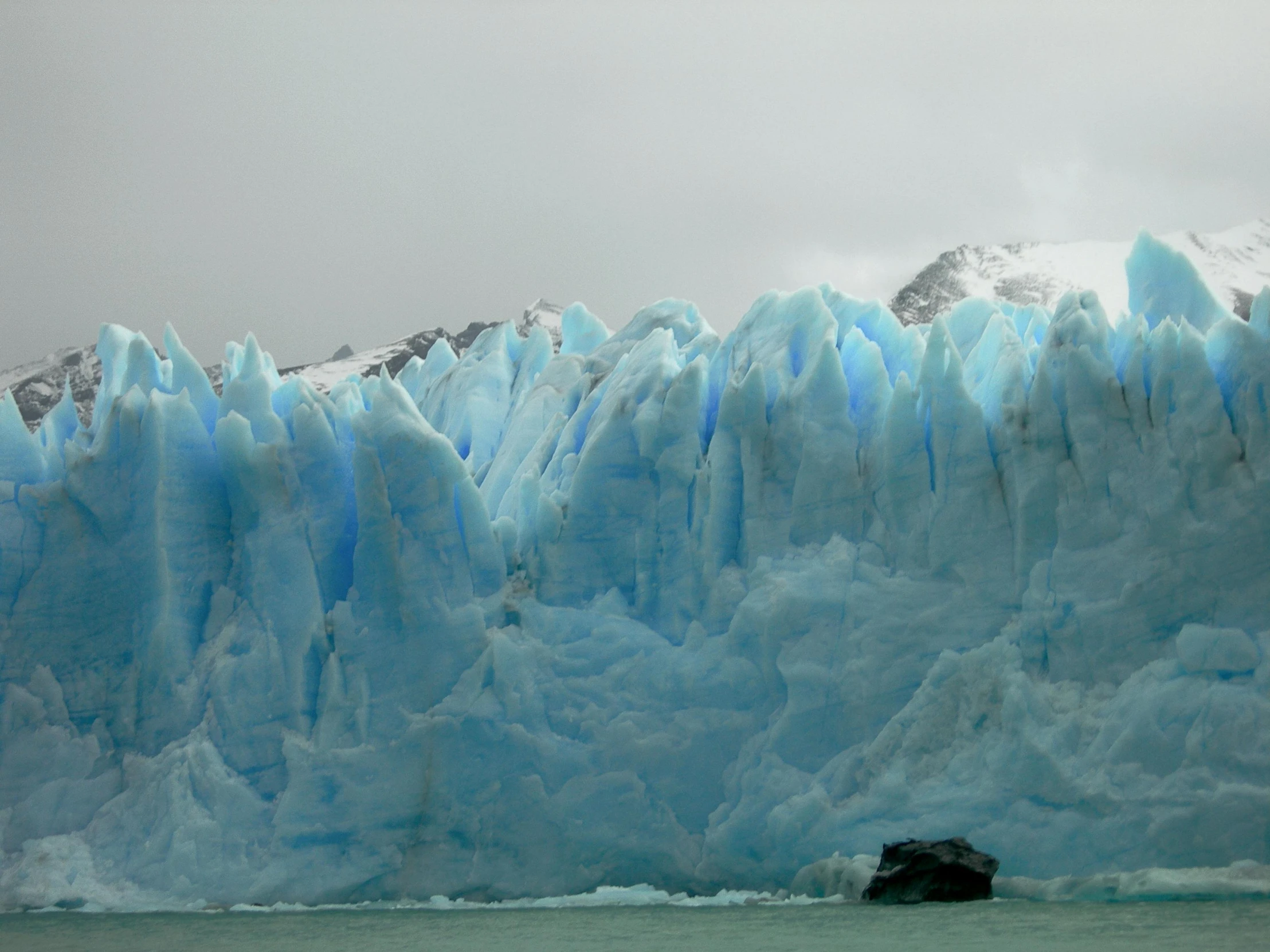 a large ice cave with rocks and water