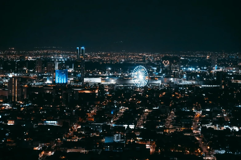 the city lights all around from a distance at night