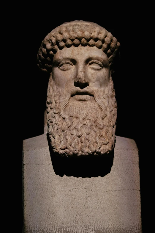 the head of an ancient roman busture is in front of a black background