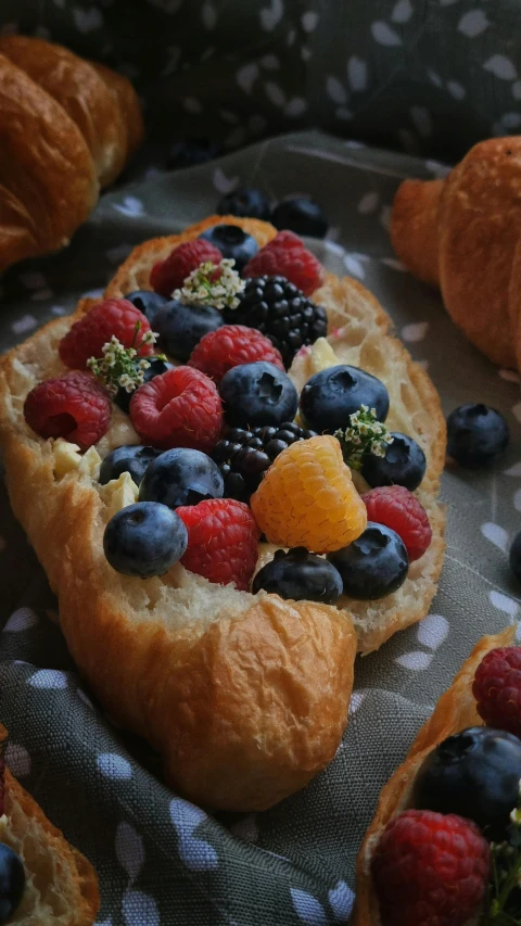 a variety of fruit arranged on an oval pastry