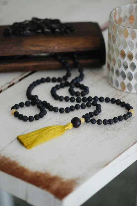 beads, beads and a can on a table