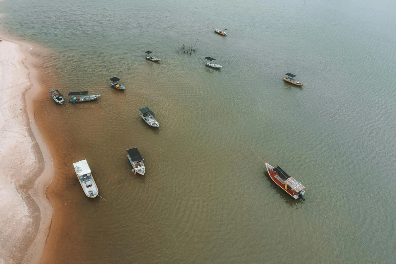 several boats are lined up in the water