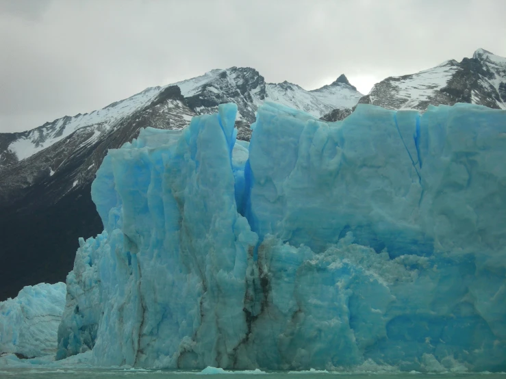 the glacier has a massive blue and white formation