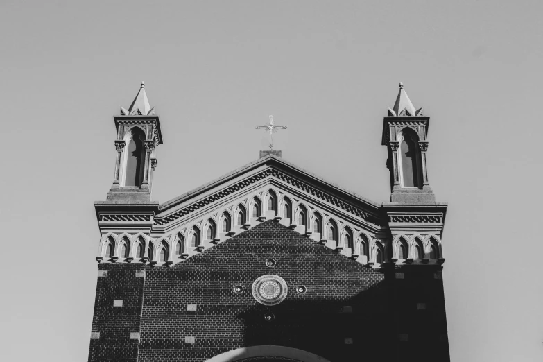 the building has two steeples and crosses on top