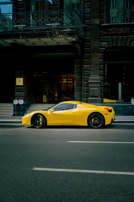 a large sports car parked on the side of a road