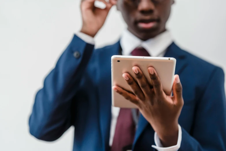 a man in a suit talking on his cell phone