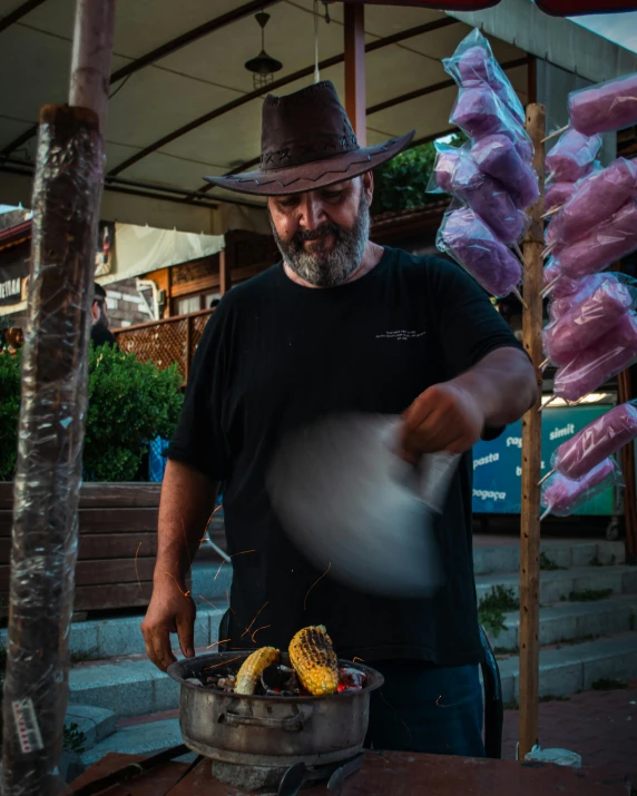 a man prepares food in the outdoor