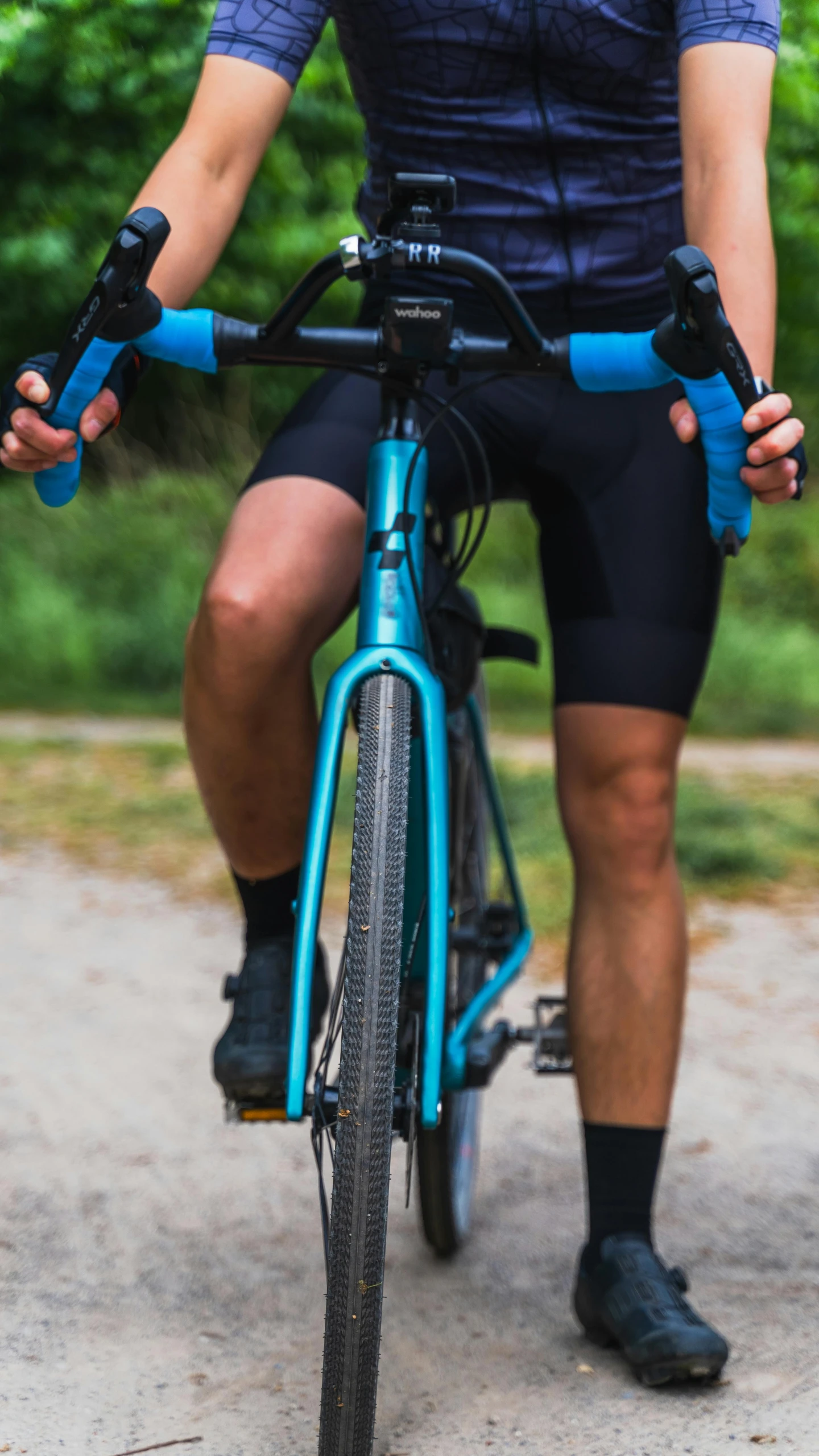 a person riding on top of a blue bike