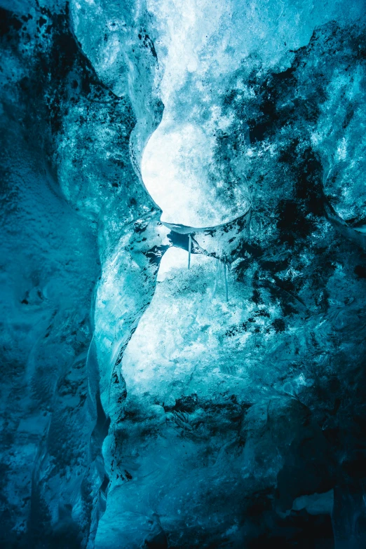 a man on a water board in the middle of a cave