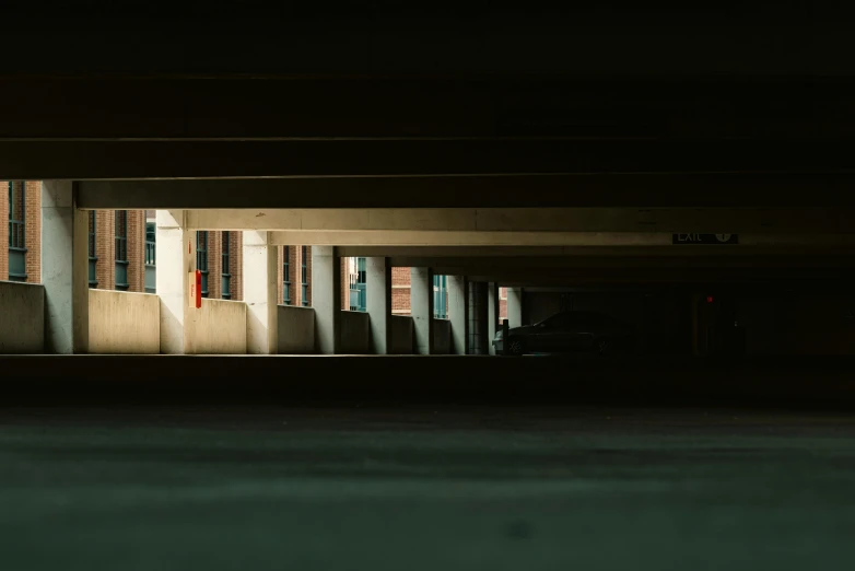 a dark room with a building and traffic lights