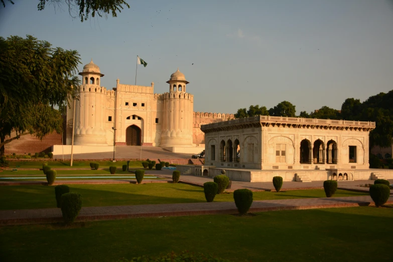 a large castle that is in a lush green park