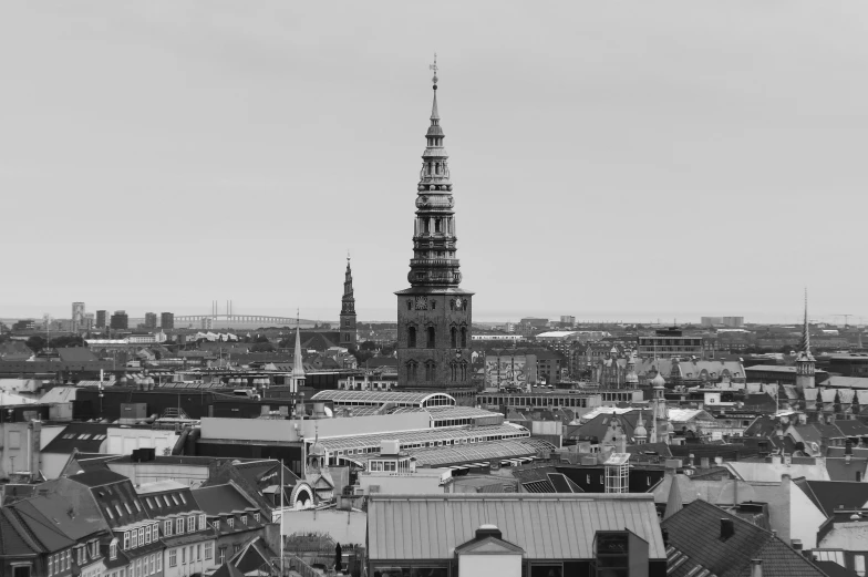 a black and white picture of a tower with a clock
