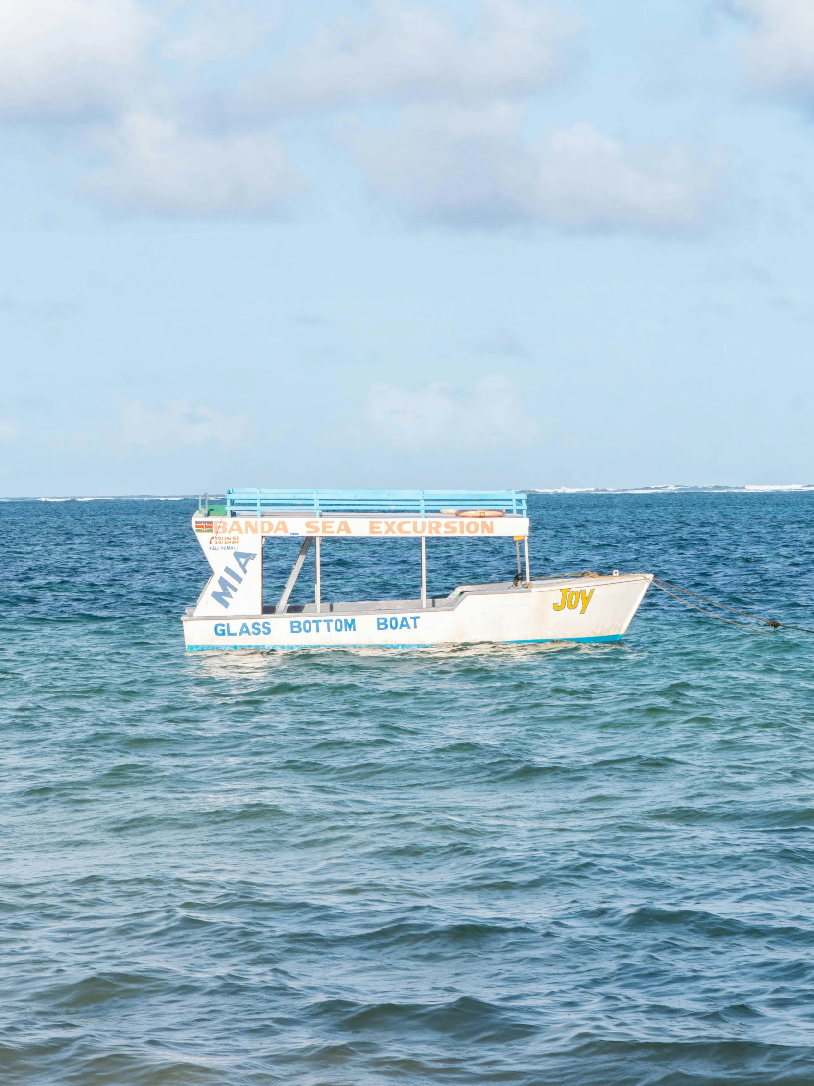 an outbuilding structure in the ocean by a boat