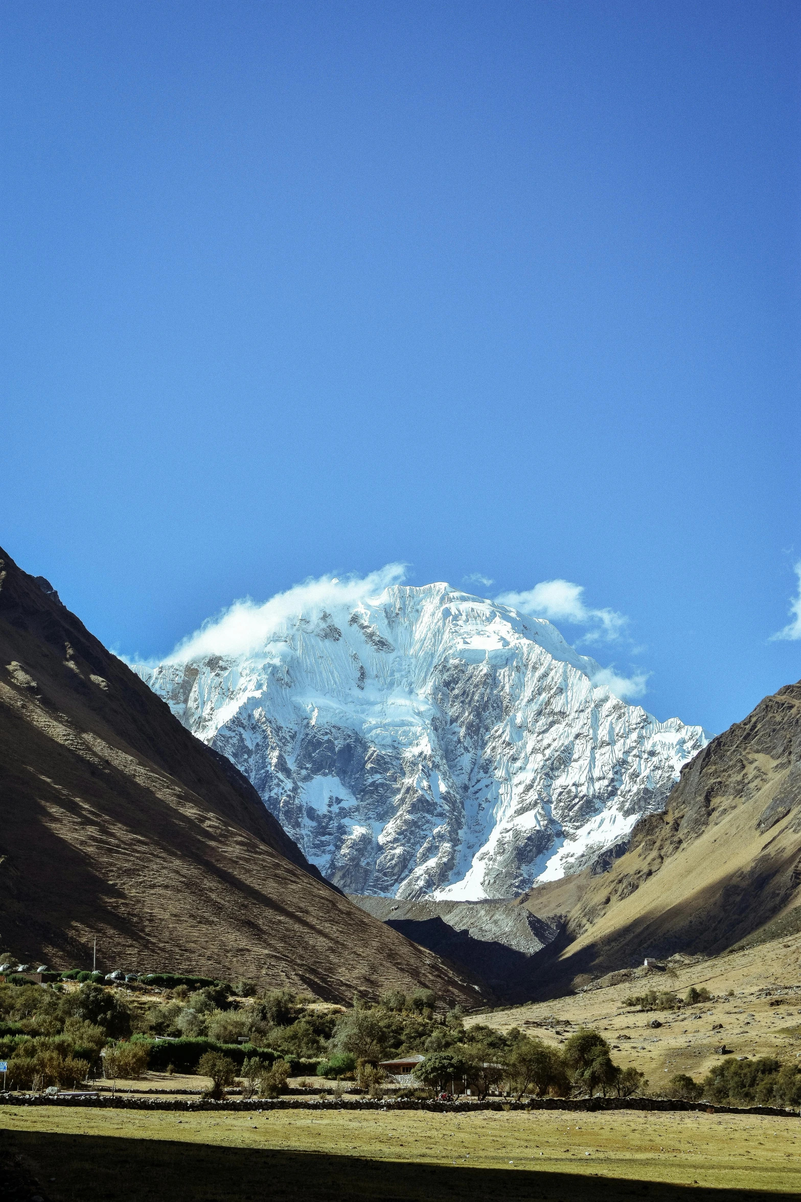 a scenic mountain view with snow on the top