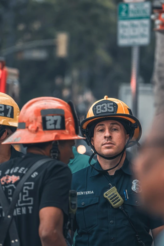 a group of people with helmets talking to each other