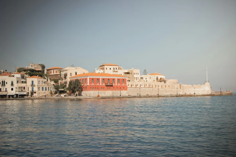 a large body of water near a city with tall buildings