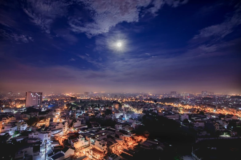 the view of the city lights and night sky from an above