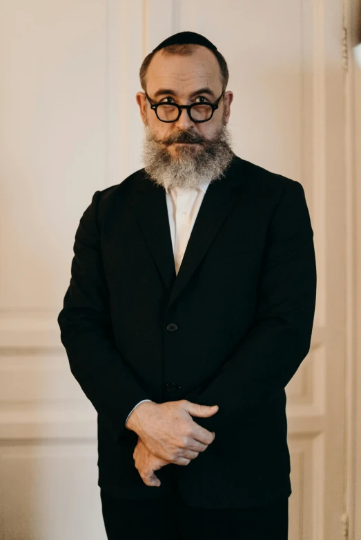 an image of a man that has a beard and glasses