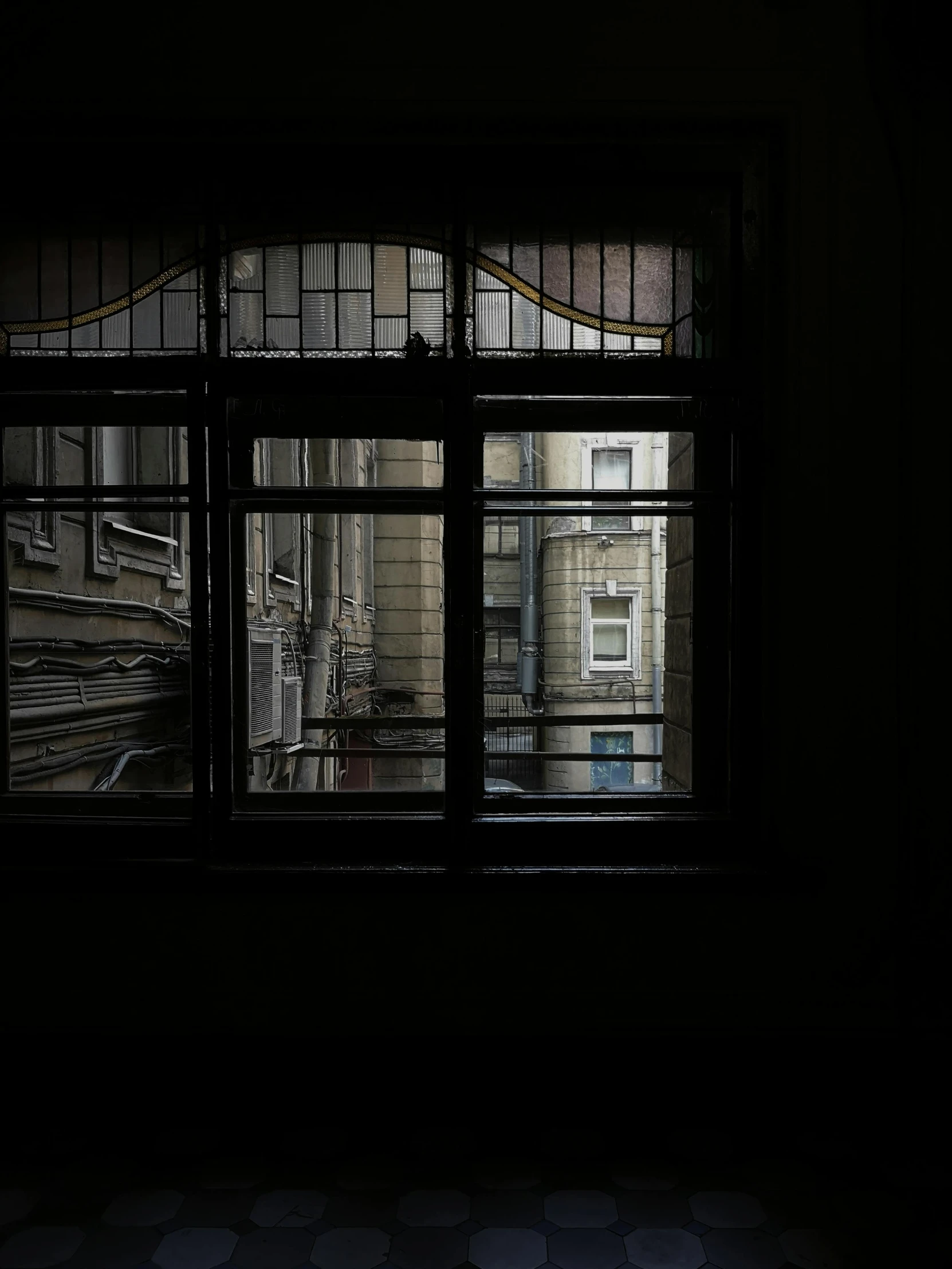 view from inside an open window of an old building