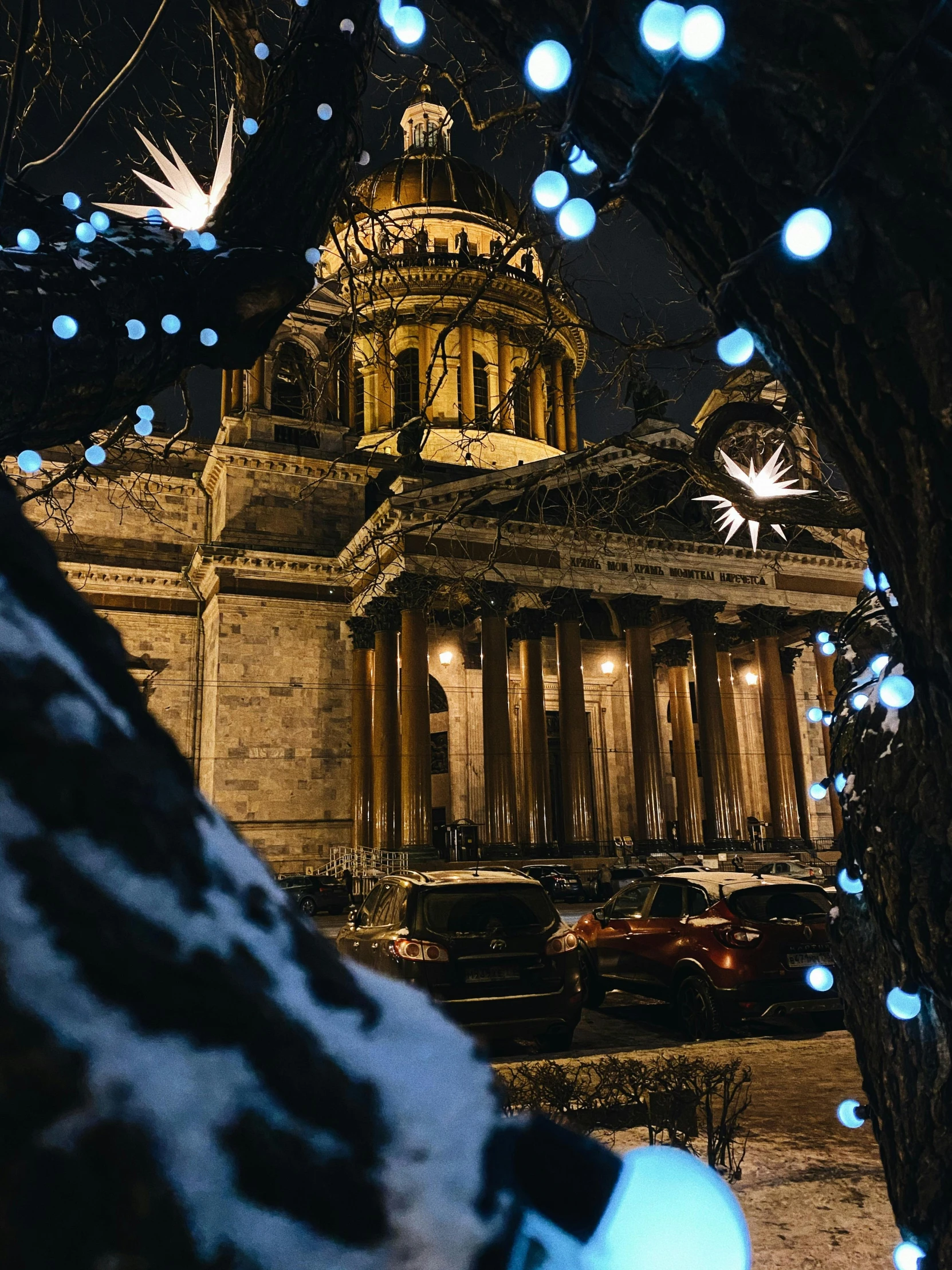 a building in a city with christmas lights