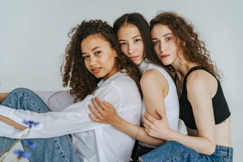 three beautiful women posing for a picture together