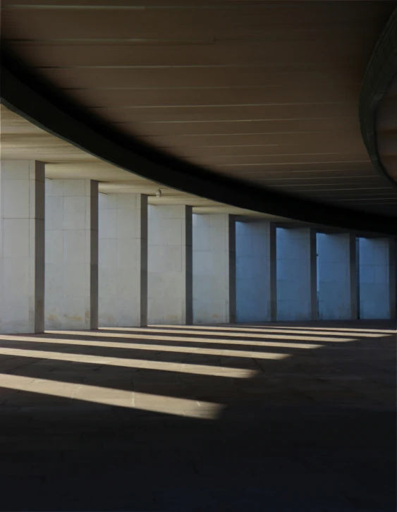 a empty parking lot with several doors next to it