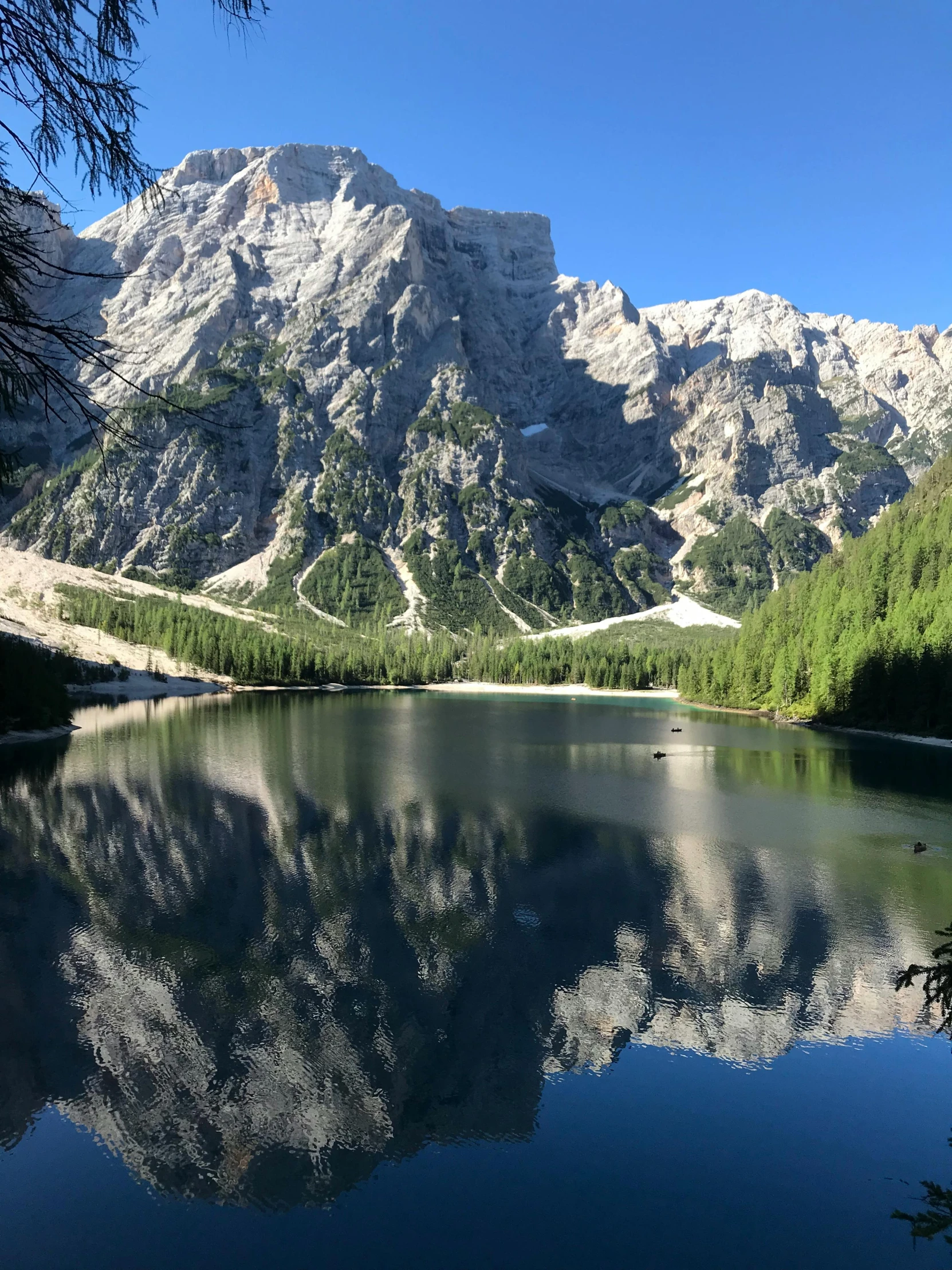 a big mountain with a lake in the middle