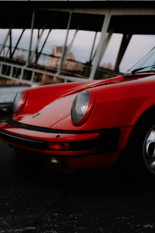 a red sports car is parked in front of a building