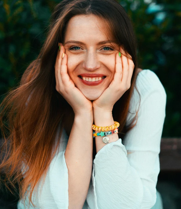 a woman with a green celet on her wrist