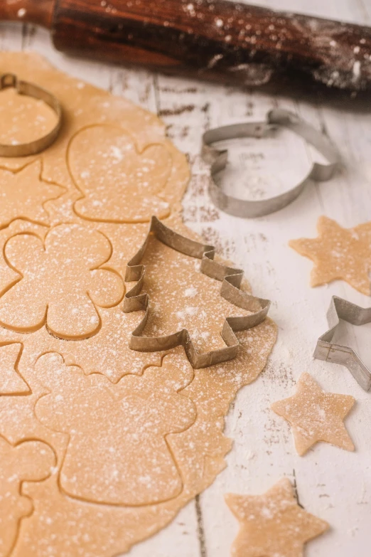 the cookie cutter is sitting beside a cookie decoration