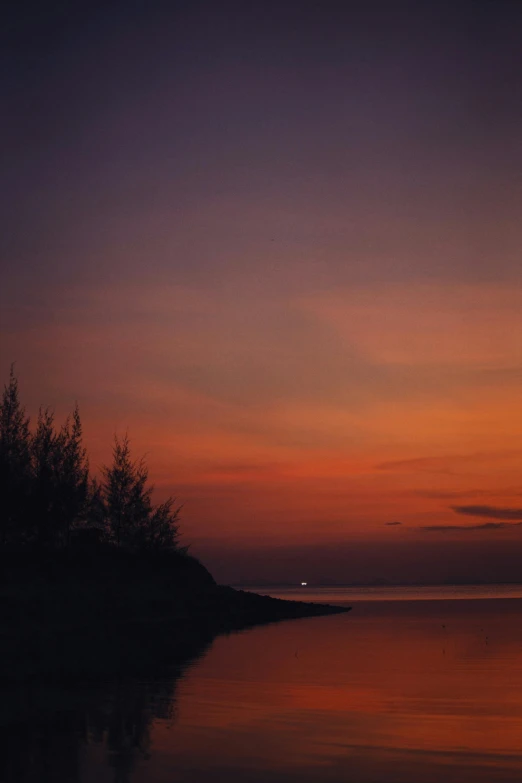 sunset with a boat in the ocean