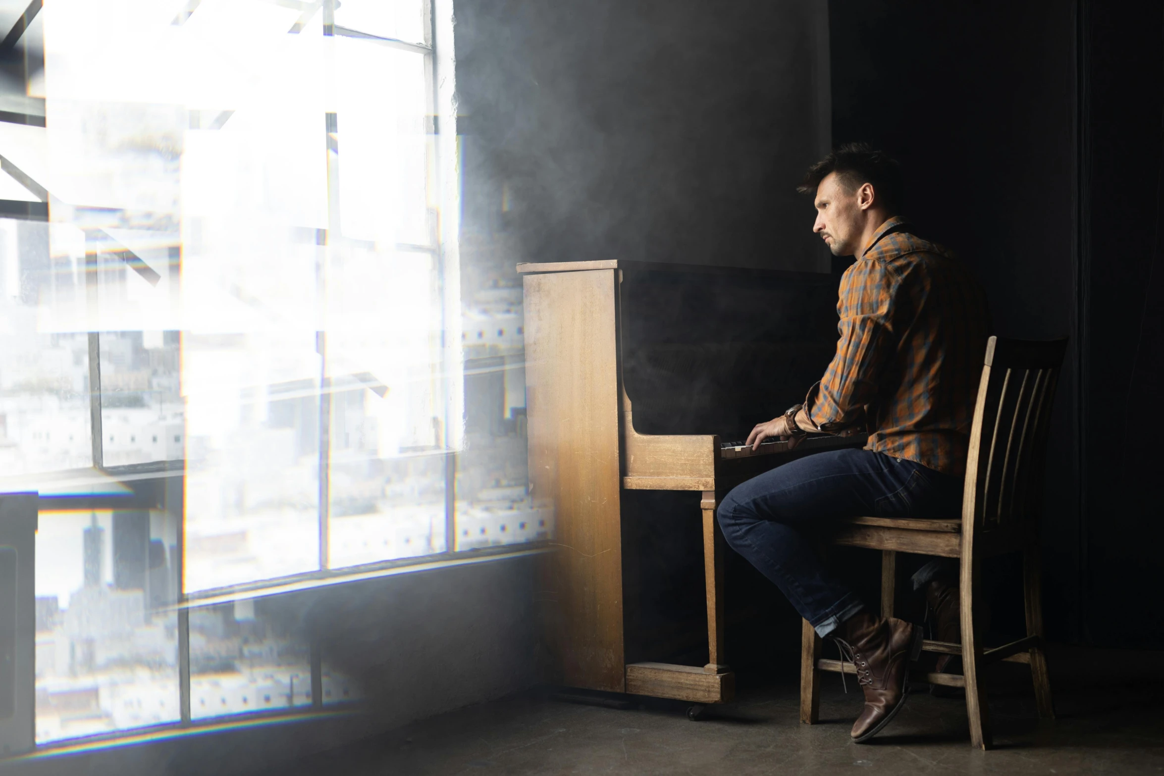 a man is sitting on the edge of a chair