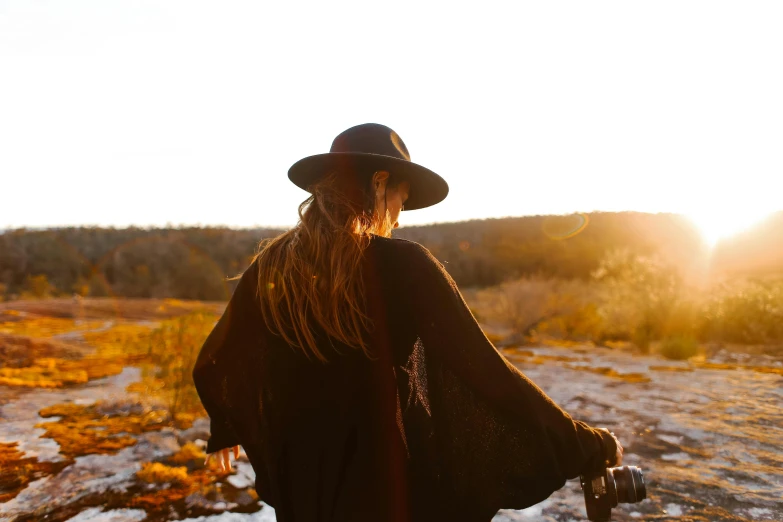 a person with a hat and long hair