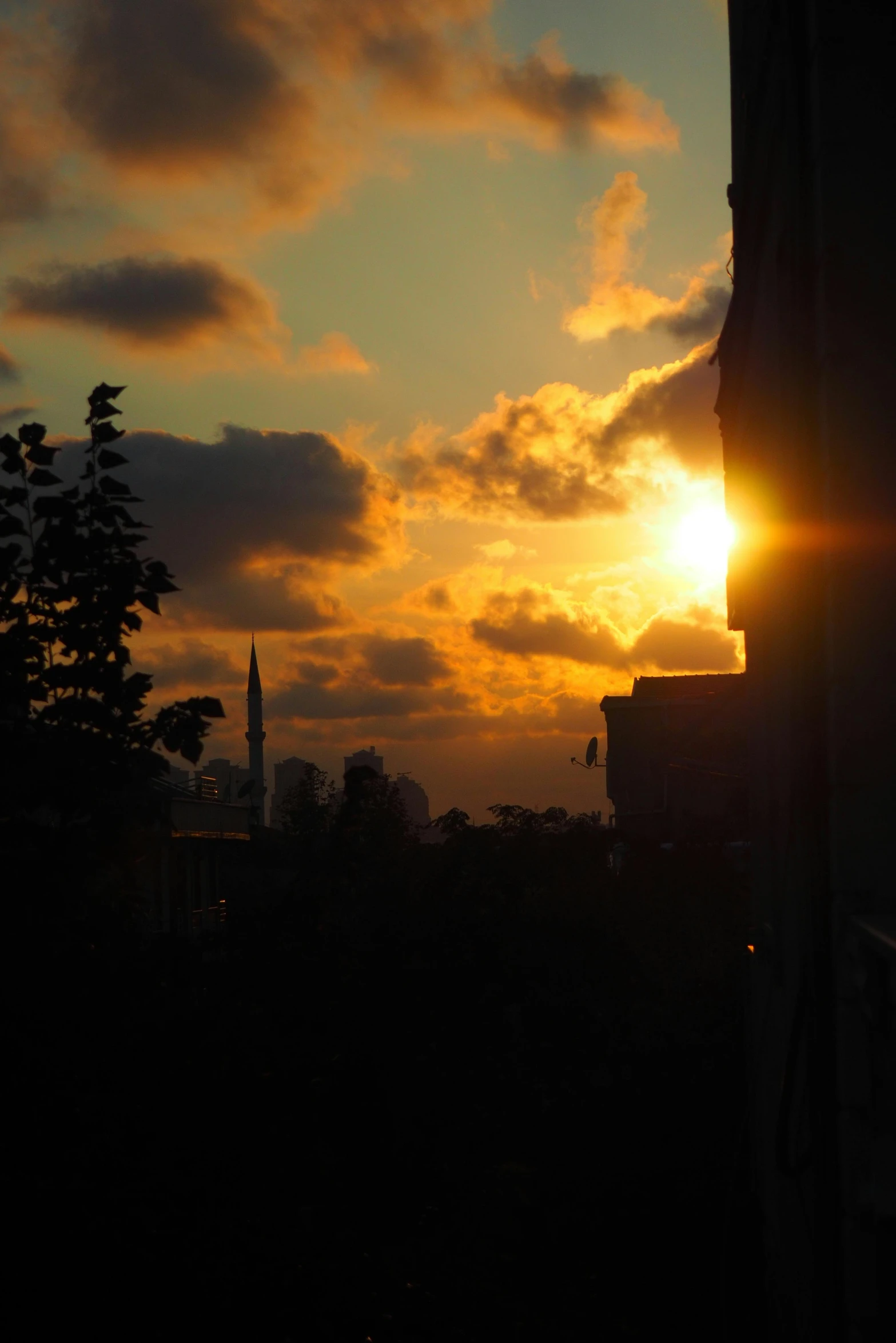 a view of the sun in a cloudy sky