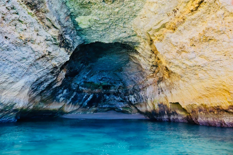 an ocean cave near a rocky cliff