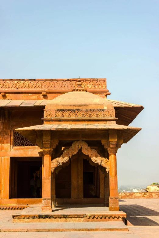 an ancient temple built in stone to look like it is being constructed