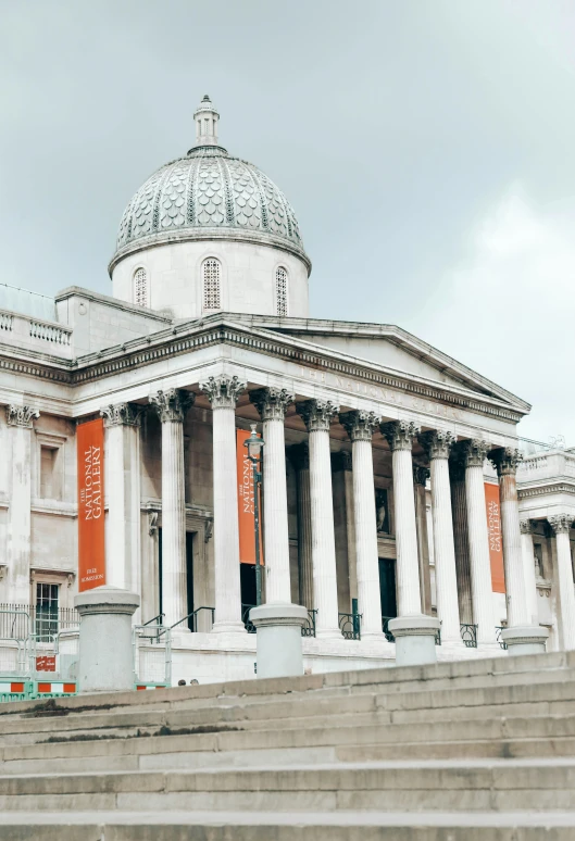 the large building has many columns on the sides