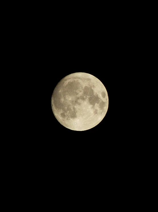 the full moon is shining brightly in the night sky