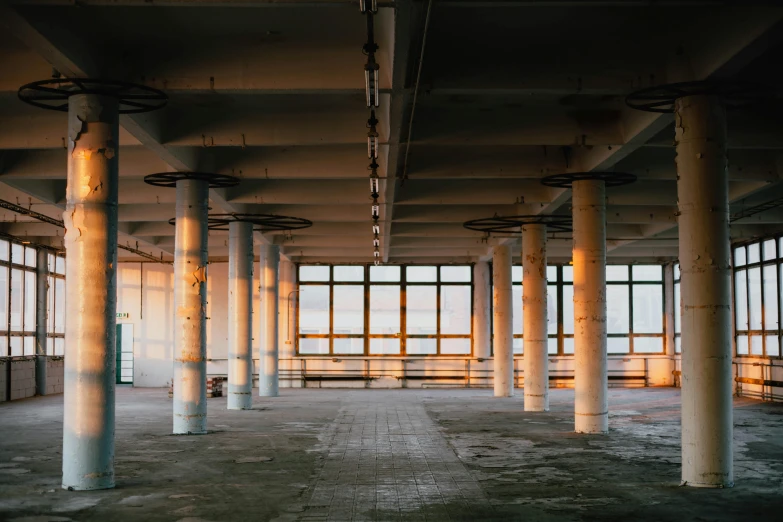 a large building with multiple windows and poles