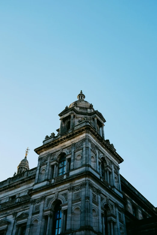 the top of a building with clocks on it