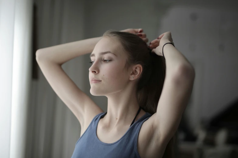 a woman is wearing headphones and posing