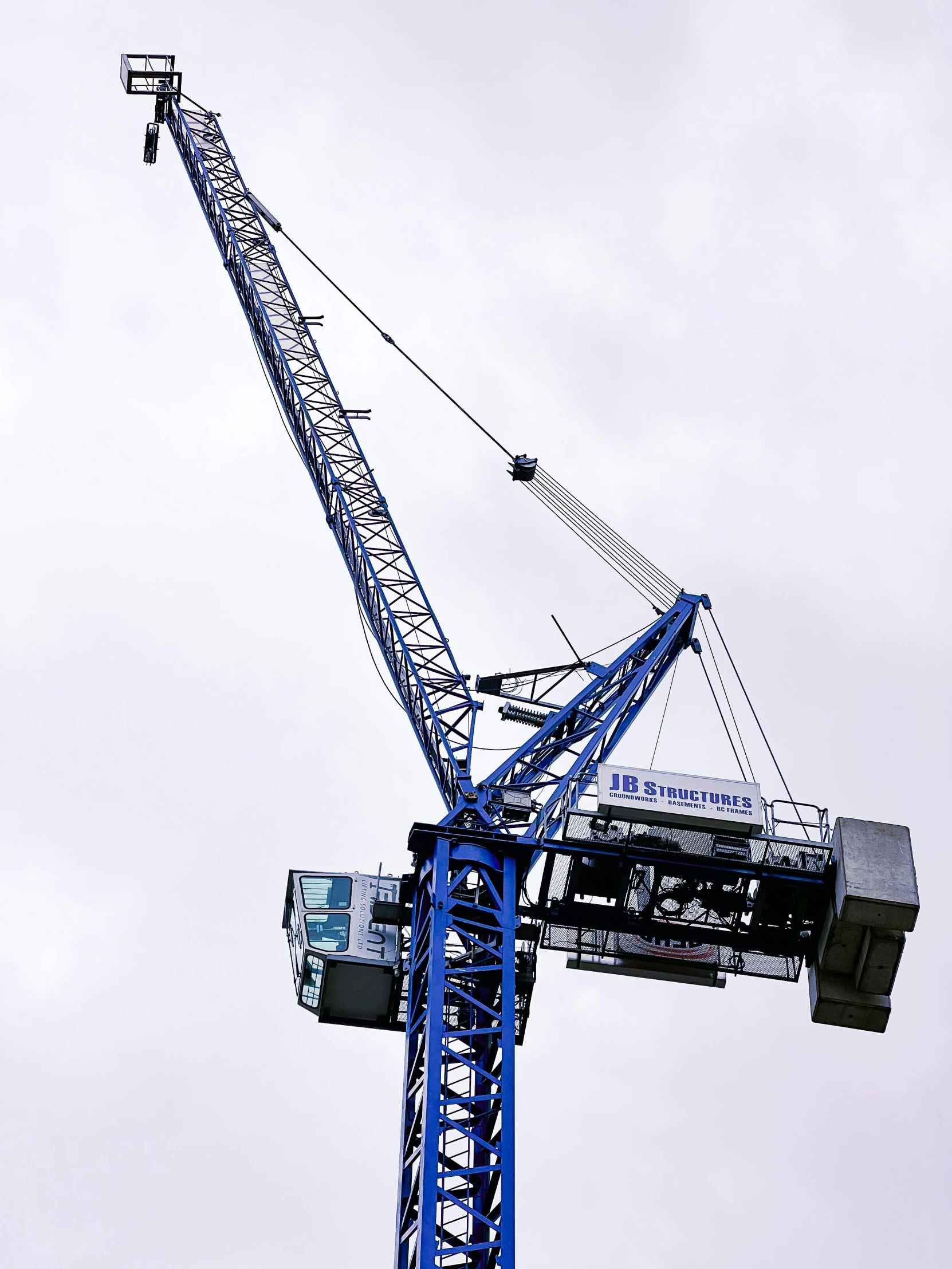 a crane is seen against a sky background